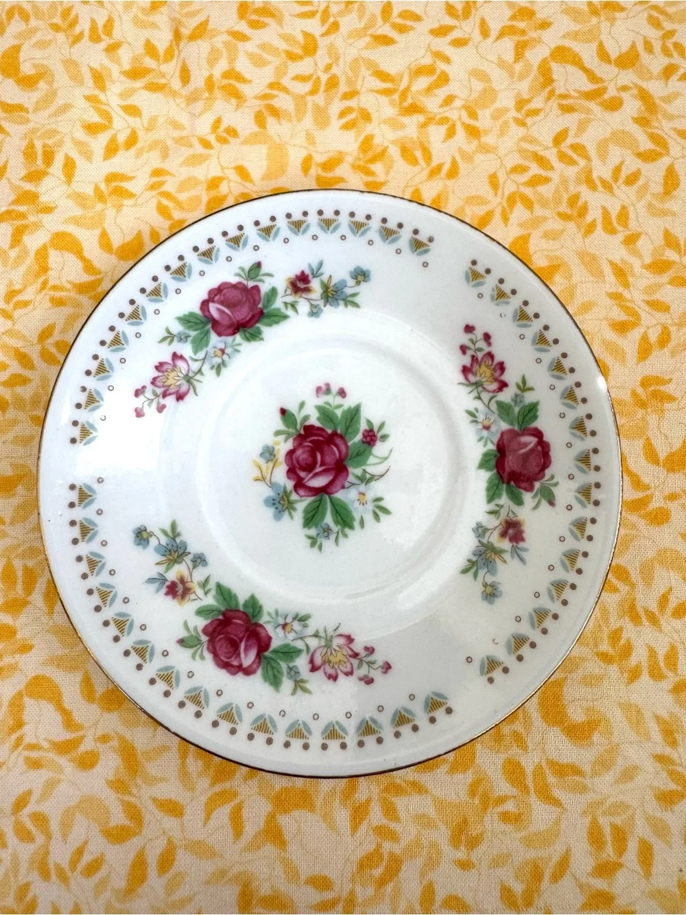 Vintage Espresso Cup and Matching Saucer. White Porcelain with Floral Motif.